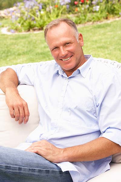 man smiling after restorative dentistry procedure in Dallas, GA